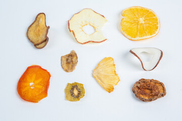 Dried fruits isolated on white background. Healthy eating concept. Top view. Healthy vegetarian food concept. Dried fruit chips.