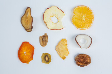 Dried fruits isolated on white background. Healthy eating concept. Top view. Healthy vegetarian food concept. Dried fruit chips.