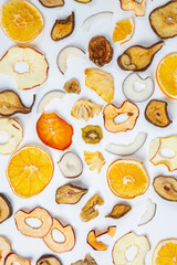 Dried fruits isolated on white background. Healthy eating concept. Top view. Healthy vegetarian food concept. Dried fruit chips.