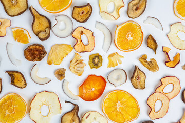 Organic Healthy Assorted Dried Fruit Mix close up. Dried fruit snacks. dried apples, mango, feijoa, dried apricots, prunes top view