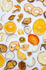 Organic Healthy Assorted Dried Fruit Mix close up. Dried fruit snacks. dried apples, mango, feijoa, dried apricots, prunes top view