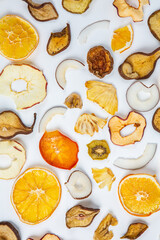 Dried fruits isolated on white background. Healthy eating concept. Top view. Healthy vegetarian food concept. Dried fruit chips.
