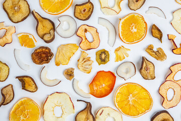 Dried fruits isolated on white background. Healthy eating concept. Top view. Healthy vegetarian food concept. Dried fruit chips.