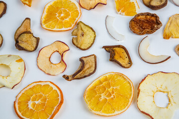 Dried fruits isolated on white background. Healthy eating concept. Top view. Healthy vegetarian food concept. Dried fruit chips.