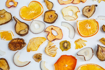 Dried fruits isolated on white background. Healthy eating concept. Top view. Healthy vegetarian food concept. Dried fruit chips.