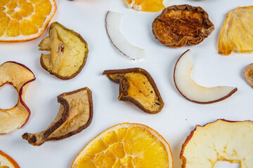 Dried fruits isolated on white background. Healthy eating concept. Top view. Healthy vegetarian food concept. Dried fruit chips.