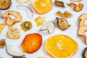 Healthy vegetarian food concept. Assortment of dried fruits, nuts and seeds on white background. Top view. Mixed nuts set closeup.