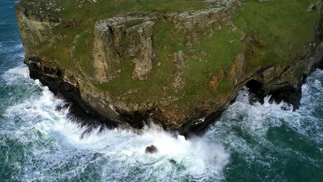 Drone footage around Tintagel Castle on a windy day