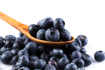 Fresh blueberries in wooden spoon