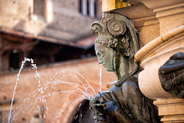 The element of monumental Fountain of Neptune in Bologna, Piazza Maggiore. Statue of lactating nereid. Italy. © Olga