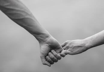 Man and woman hands holding together