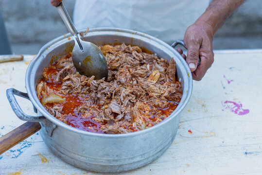 Birria de carnero, typical dish from jalisco, Mexico. Ram meat in an aluminum pot.