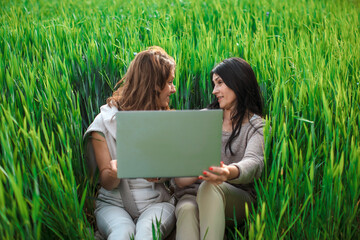 Two woman working with laptop 