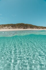 Beautiful landscape of clear water facing the sandy beach on a sunny morning