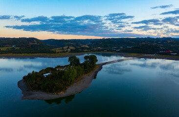 Obraz premium Bird's-eye view of the Aucar Island connecting with land with a wooden walkway