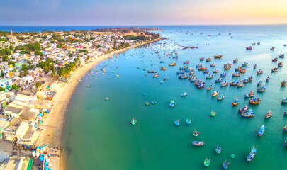 Aerial view of Mui Ne fishing village in the morning with hundreds of boats anchored to avoid...