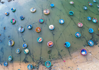 Aerial view of Mui Ne fishing village in the morning with hundreds of boats anchored to avoid storms, this is a beautiful bay in central Vietnam