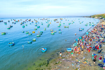 Mui Ne fish market seen from above, the morning market in a coastal fishing village to buy and sell seafood for the central provinces of Vietnam