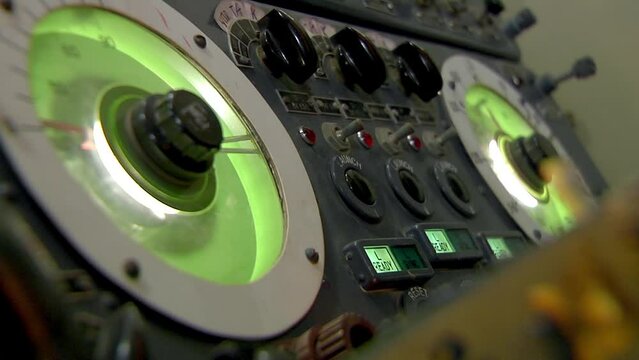 Hand pushing buttons on control panel, Moscow, Russia