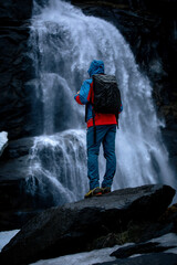 Hiker in front of Waterfall in Austria - Krimmler Waterfalls