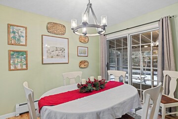 Cozy living room with a table and chairs