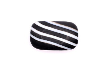 Black and white striped soap bar with charcoal. Detox soap. Body hygiene. Skin care. Isolated on white background. Selective focus.