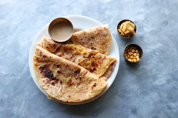 Puran Poli is an Indian sweet flatbread stuffed with chana dal, jaggery, ghee and cardamom and is...