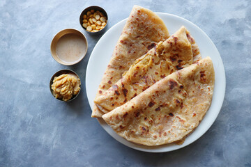 Puran Poli is an Indian sweet flatbread stuffed with chana dal, jaggery, ghee and cardamom and is usually eaten at Holi or Gudi Padva festival. Recipe ingredients. copy space. Healthy sweet dessert. 