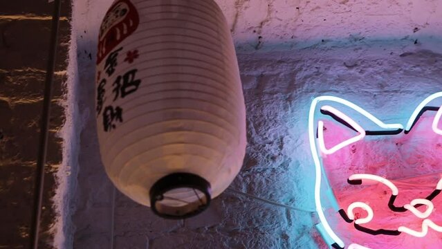 Neon sign with a picture of a Japanese cat