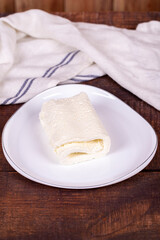 Clotted cream on wood background. Clotted cream (butter cream) for Turkish breakfast. local name inek kaymak