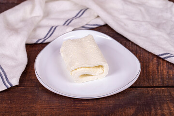 Clotted cream on wood background. Clotted cream (butter cream) for Turkish breakfast. local name...