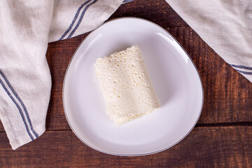 Clotted cream on wood background. Clotted cream (butter cream) for Turkish breakfast. local name inek kaymak. Top view