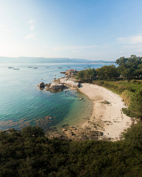 Aerial view of Punta cabalo lighthouse and Sualaxe beach in Illa de Arousa, Ria de Arousa, Pontevedra, Galicia, Spain.