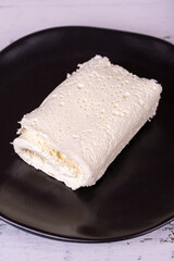 Clotted cream on wood background. Clotted cream (butter cream) for Turkish breakfast. local name inek kaymak. Close up