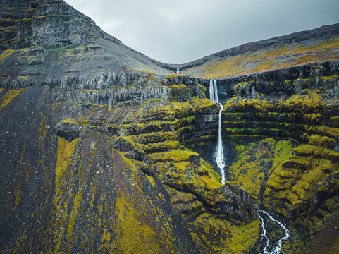 Aerial view of Krosslaug hot spring waterfall, Westfjords, Iceland.
