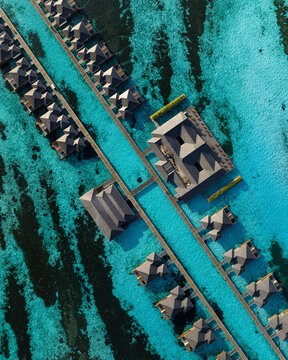 Mal&egrave;, Maldives - 11 March 2023: Aerial view of Villa Nautica luxury resorts with bungalow on the barrier reef.