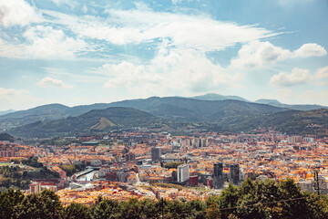 Landscape view of Bilbao city from Artxanda mountain on a sunny day. Enjoying a nice vacation in the Basque Country, Spain