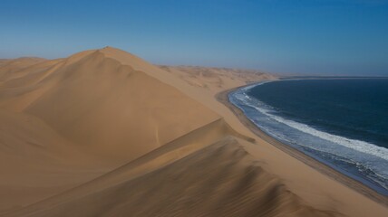 Fototapeta na wymiar Vast desert landscape of Walvis in Namibia under a clear sky