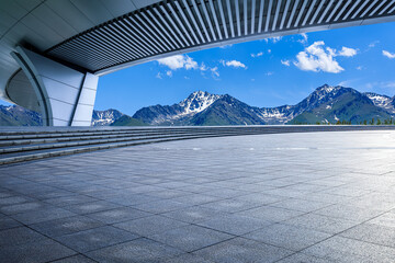 Empty square floor and bridge with mountain background