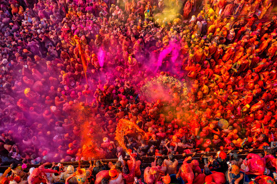 Nandgaon, India - 01 March 2023: Aerial view of people celebrating the holy colour festival at Shri And Baba Temple, Uttar Pradesh, India.