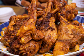 Roasted leg pieces of mutton at a street food market in Dhaka, Bangladesh