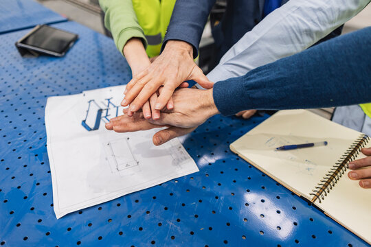 Engineers stacking hands togetherness in unity