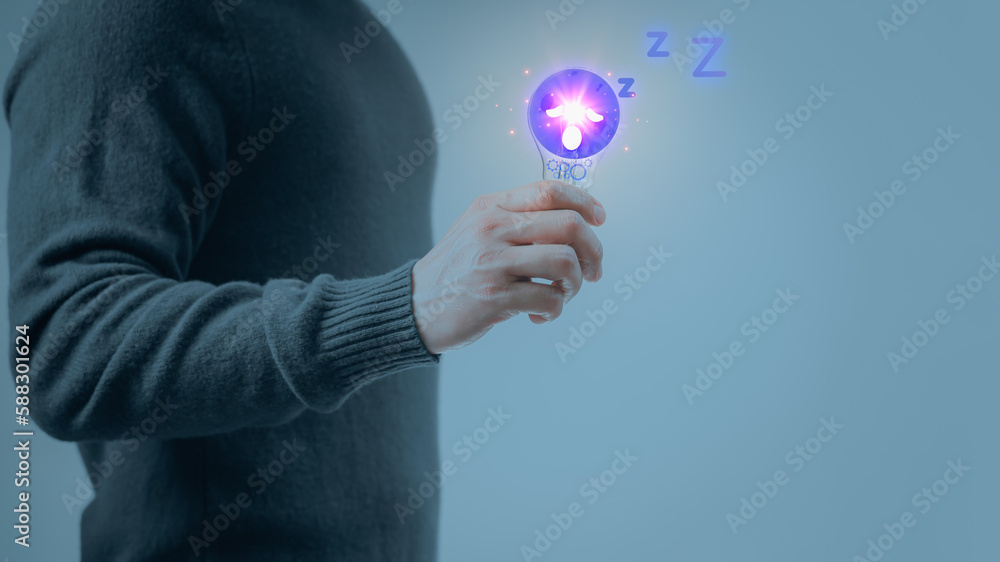 Poster man hand holding illuminated light bulb wiht sleepy icon, concepts tired of solving business problem