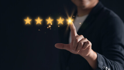 Man pointing to give a five-star rating, symbolizing customer satisfaction and feedback. Concept of positive reviews and excellent service quality.