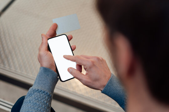 Businessman touching screen of smart phone at office