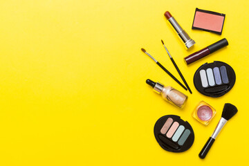 Professional makeup tools. Top view. Flat lay. Beauty, decorative cosmetics. Makeup brushes set and color eyeshadow palette on table background. Minimalistic style