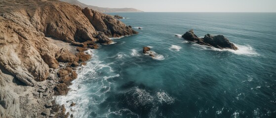 A beautiful picture of a rocky beach with a cliff from above.Aerial view. Panoramic shot. Generative AI