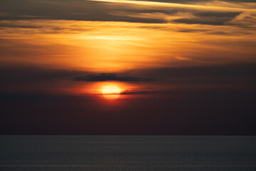 Fototapeta na wymiar Fiery orange sunset from the coast of Cornwall