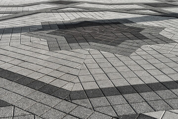The texture of a stone old pavement with a perspective.