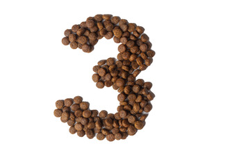 Number 3 made from dry pet food on a white background. Dietary therapeutic nutrition for dogs and cats.